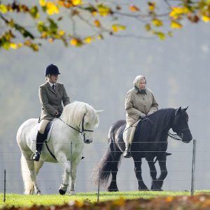 Queen Elizabeth II accompanied by a Groom out riding by the River Thames at Windsor, Berkshire, Britain - 02 Nov 2015